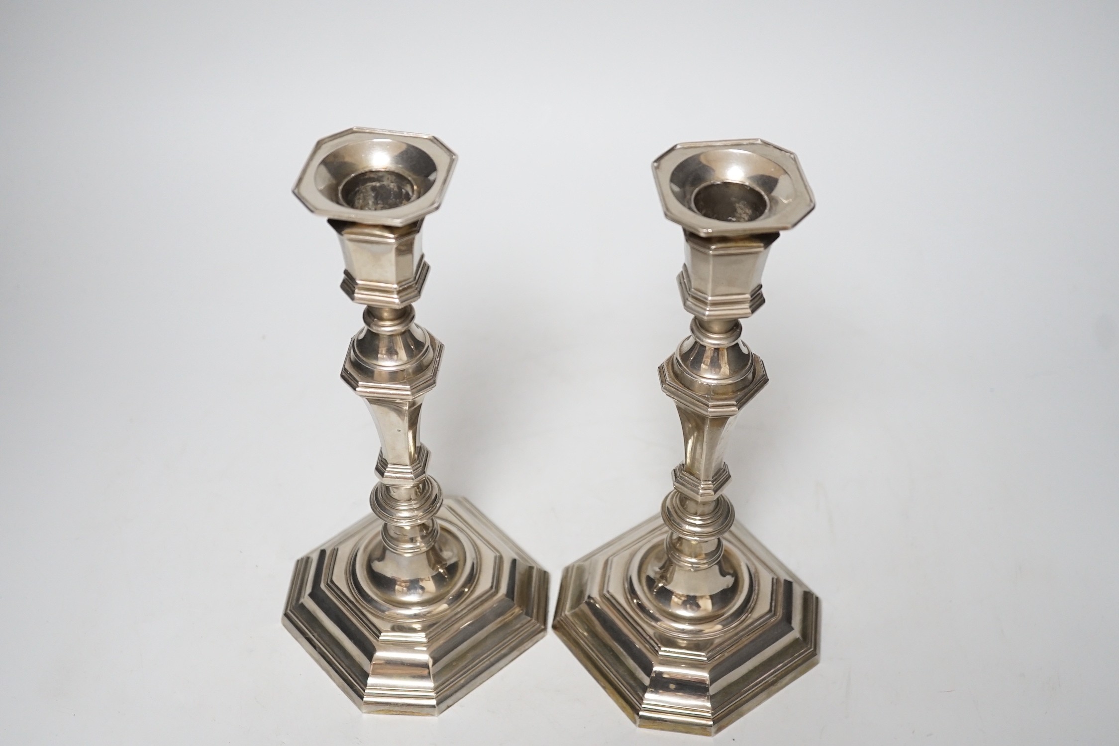 A pair of 18th century style plated octagonal candlesticks, 24.5cm.